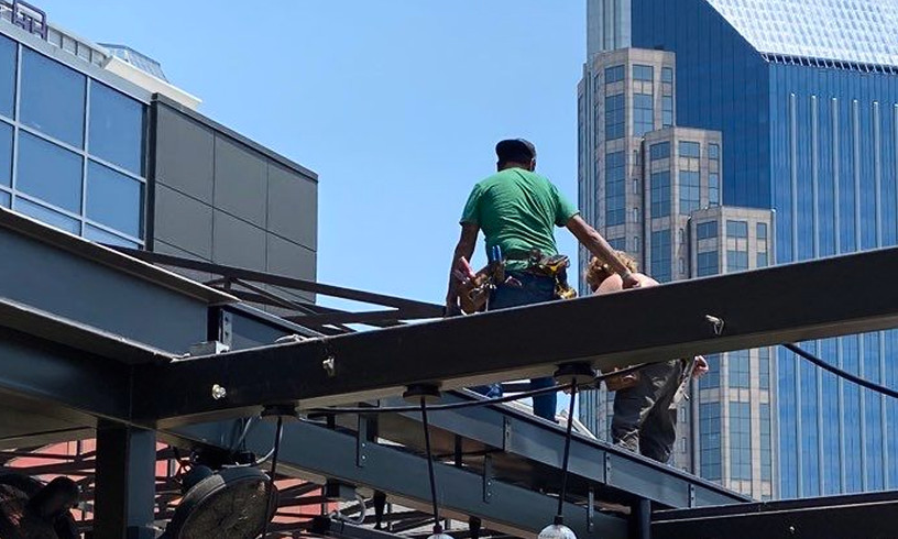 Crew working building frame