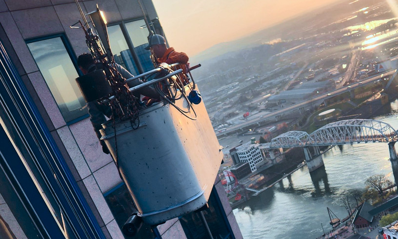 Crew suspended from tall building