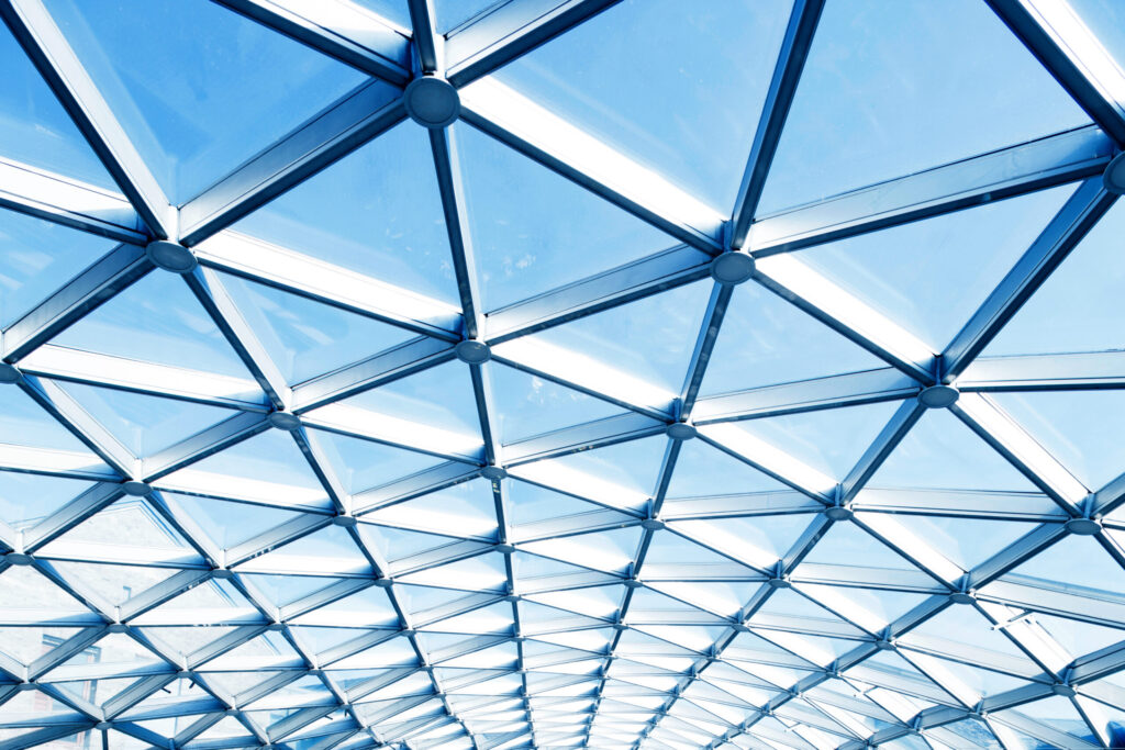 Geometric glass-and-steel canopy viewed from below